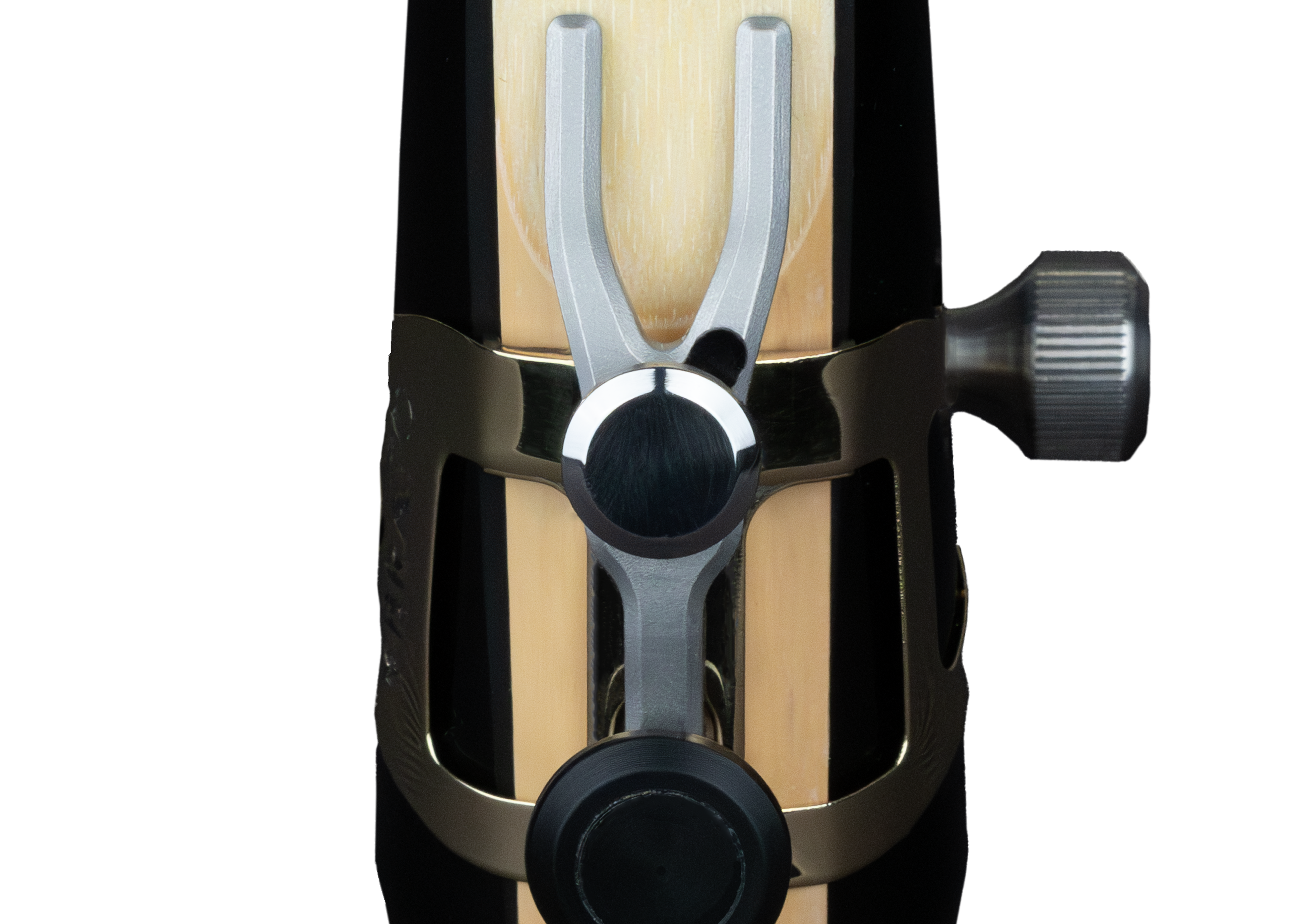 Close-up of the Ybrato SweetSpot Ligature on a saxophone mouthpiece, focusing on the reed tip adjustment mechanism