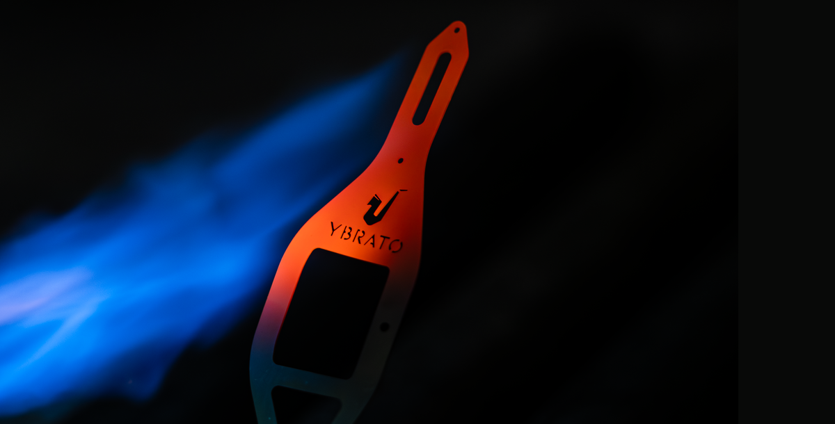 YBRATO SweetSpot Ligature during the manufacturing process, illuminated by blue flame - mobile view