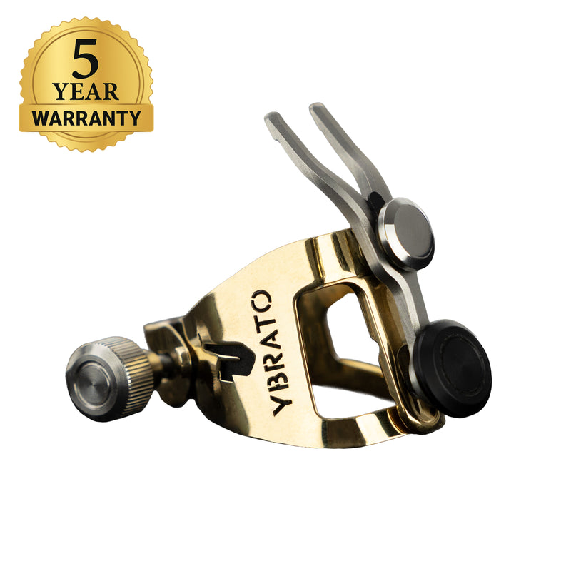 Ybrato SweetSpot Ligature for saxophone and clarinet, gold finish, shown with a 5-year warranty badge